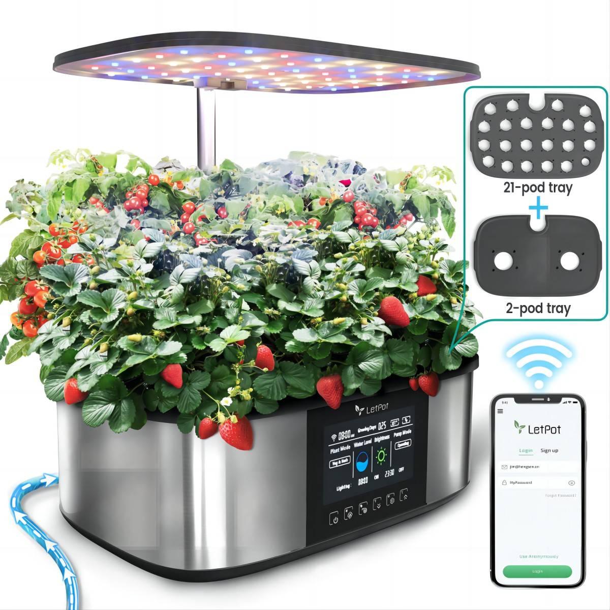 Smart indoor hydroponic garden system with LED grow light, fresh strawberries, cherry tomatoes, and app connectivity.